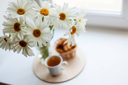 Still life with   bouquet of wild flowers in   transparent jug. の写真素材