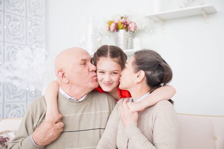 Teen girl with her grandparents.の写真素材