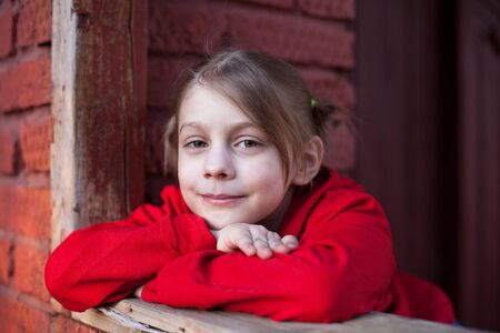 Portrait of blonde little girl outdoor