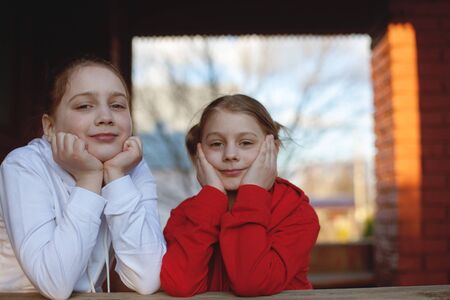 Portrait of two   girlfriends outdoorの写真素材
