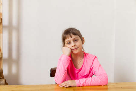 Portrait of eight years old, caucasian, happy blond child girl (kid) .Free text (copy) space