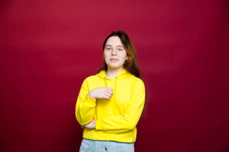 Portrait of Russian teenage girl on red
