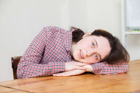 Teen girl with long hair posing in studioの写真素材