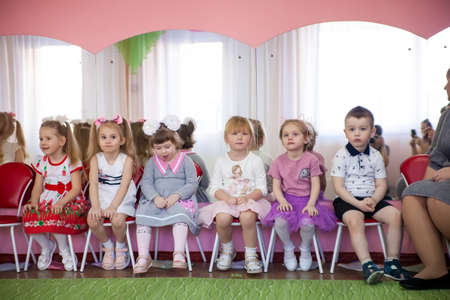 Saint-Petersburg, Russia - March 8, 2022: Little children in beautiful outfits celebrate feast of...