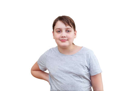 Studio shot of teen 12 year old girl standing against white background