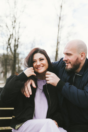 Attractive stylish couple in love posing outdoor, hugging and walking on street. fashionable look....
