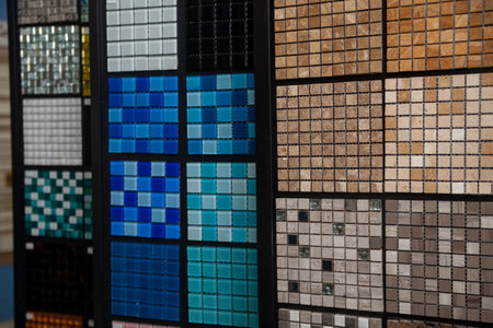 Showcases with colorful glass and stone mosaics in construction store.の写真素材