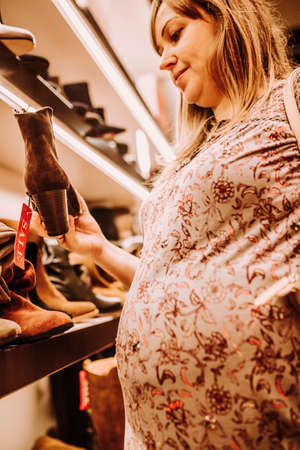 pregnant woman doing shopping early in the morningの写真素材