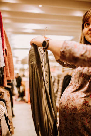 pregnant woman doing shopping early in the morningの写真素材
