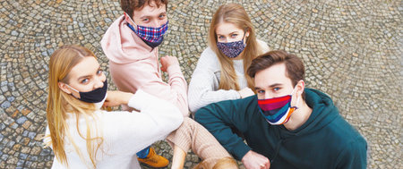 Multiracial friends teamwork elbow bump - Friends wearing mask and greeting each other - New normal...