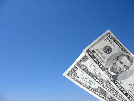 dollar bills isolated on a blue sky