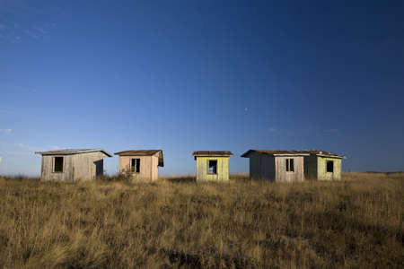 Abandoned old bungalows on a hill topの写真素材