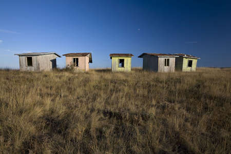 Abandoned old bungalows on a hill topの写真素材