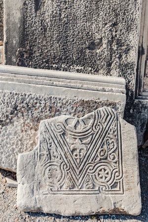 Close-up of ancient stone columns in a historic Turkish city. Intricate carvings and weathered textures reflect the architectural grandeur and rich history of the ancient civilization.の写真素材