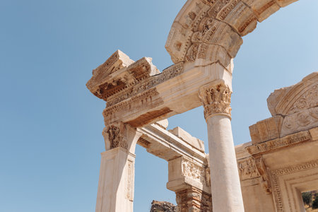 Ancient stone gate leading into a historic, antique city. Weathered arches and towering columns evoke a sense of timeless grandeur and mystery. Perfect for historical and archaeological themes.の写真素材