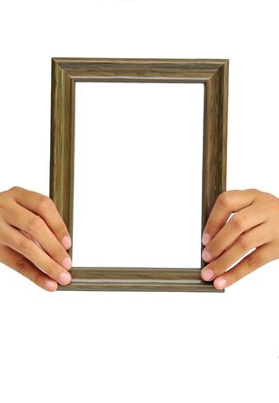 Picture frame in woman hand isolated on white background の写真素材
