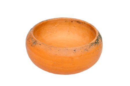Old clay cup opened on white background.
