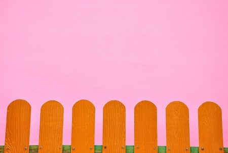 fence on a pink wall.の写真素材