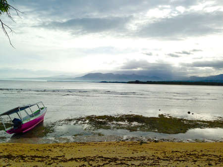 Lonely boat by islandの写真素材