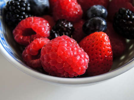 Fresh berries. Various summer berries in a bowlの写真素材