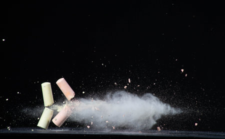 This is a photograph of pastel crayons isolated on a black backgroundの写真素材