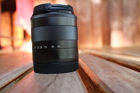 Lens is placed on the wooden floor 