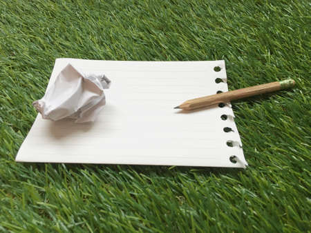 Note book on grass background