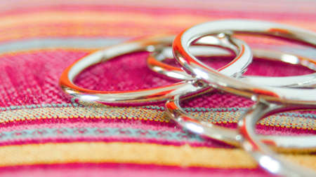 metal rings on colored background