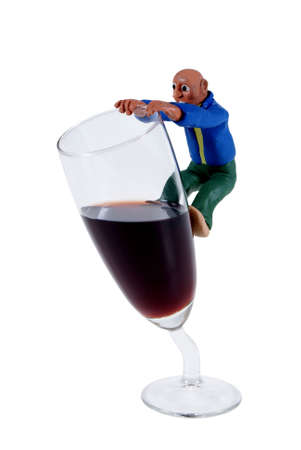 Fashioned man hung on glass isolated on white backgroundの写真素材