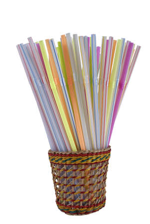sippers in colorful wicker isolated on white backgroundの写真素材