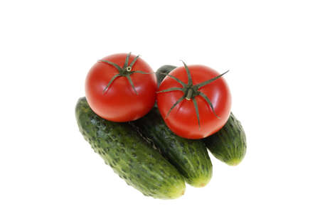tomatoes and cucumbers isolated on white backgroundの写真素材