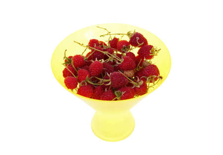ripe raspberry in yellow bowl isolated on white backgroundの写真素材