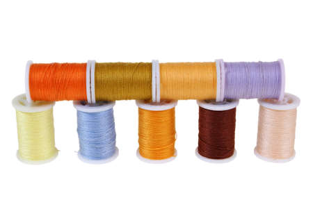 line of colorful threads isolated on white background
