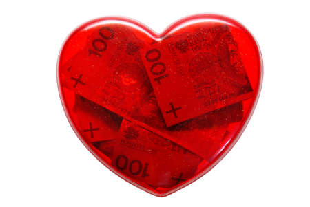 heart full of money isolated on white backgroundの写真素材