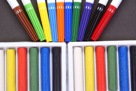 drawing accessories and plasticine on black background