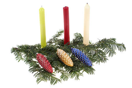 colourful glass balls and candles on branch on white backgroundの写真素材