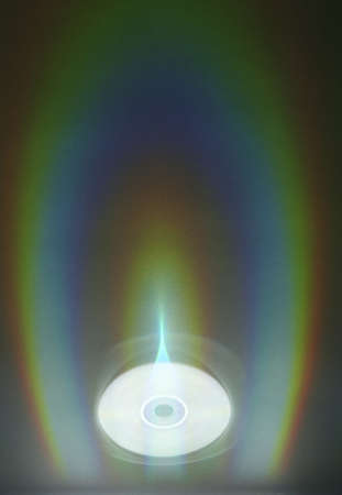 colourful reflex of light from CD as backgroundの写真素材