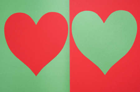 hearts composition made of paper on green backgroundの写真素材
