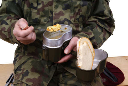 soldier eating pea soap isolated on white backgroundの写真素材