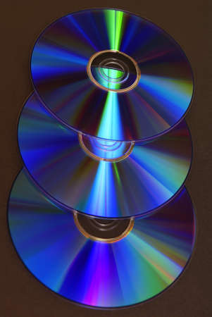 colourful compact discs on black background