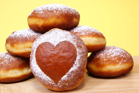 fresh and warm doughnuts isolated on yellow backgroundの写真素材