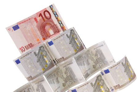 pyramid made of notes isolated on white backgroundの写真素材