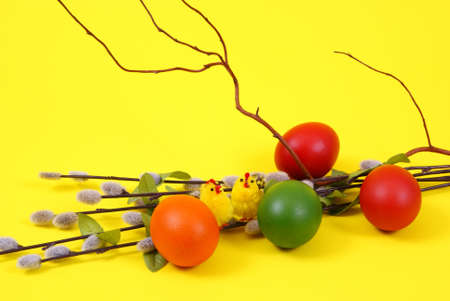colorful eggs with decoration on yellow background