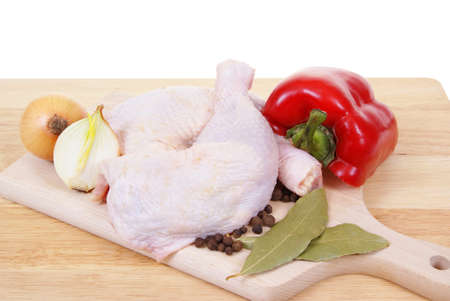 chicken with spices on board-desk isolated on white backgroundの写真素材