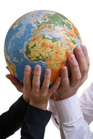 globe supported by peoples isoalted on white backgroundの写真素材