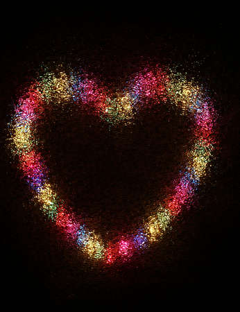 heart made with colorful lamp on black backgroundの写真素材