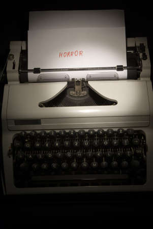 typing machine and paper with inscription horrorの写真素材