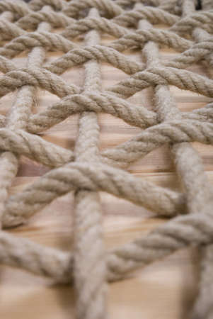 pattern made of natural rope on plankの写真素材