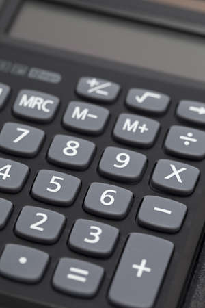 black pocket calculator to calculation as backgroundの写真素材
