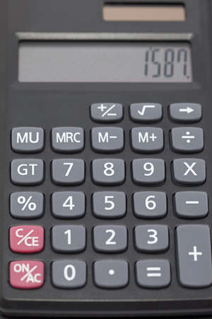 black pocket calculator to calculation as backgroundの写真素材